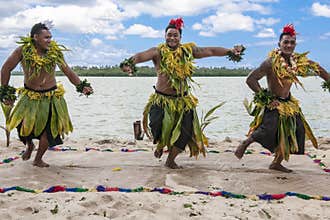 Dancers South Pacific. Young men dressed with typical dress made from nature dancing traditional dances in Tonga, Kingdom of Tonga