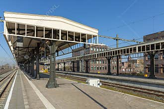 Empty railway platforms with vintage-style iron canopies Hengelo