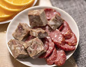 Cuts of different type of cold meats on the plate. Snack