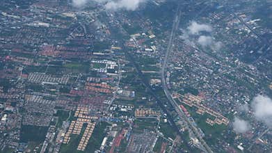 Aerial View of Fluffy White Clouds Over Landscape