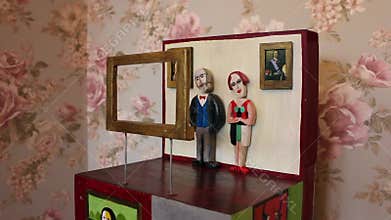viewers look at the painting, shake their heads