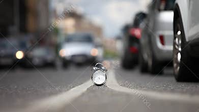 Time lapse of Vintage alarm clock on busy street