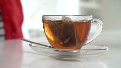 Slow Motion Sequence Of Woman Making Cup Of Tea