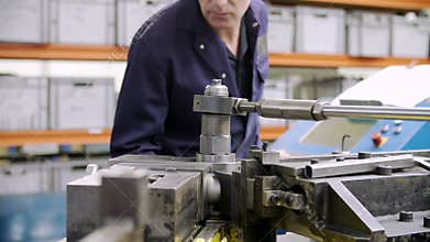 Factory Engineer Operating Hydraulic Tube Bender