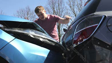 Driver Inspecting Damage After Traffic Accident