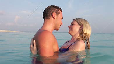 Romantic Couple Relaxing In Tropical Sea