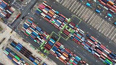 Drone shot of modern industrial container port of Singapore with containers from top view.