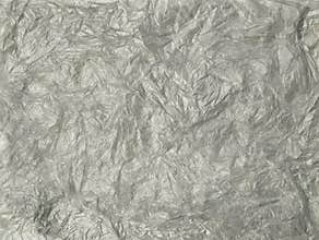 Abstrack grey crumpled plastic bag texture background