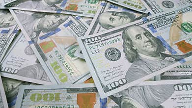 There Are Numerous Scattered U.S. Dollar Bills That Are Present in Great Abundance Around the Area