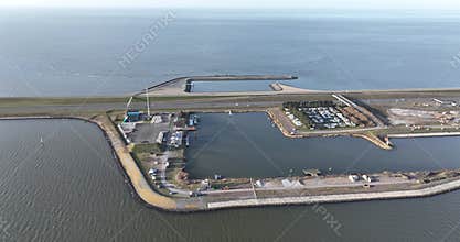 the Afsluitdijk, Breezanddijk, The Netherlands, on the former work island of Breezand, gas station, small harbour, aerial drone