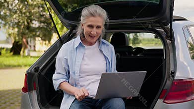 Excited astonish shocked Caucasian aged senior business woman female lady older mature businesswoman browsing laptop