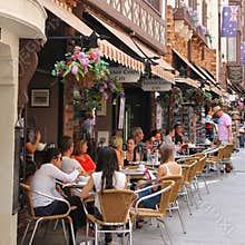People enjoy at a cosy terrace in London Court, Perth, Australia