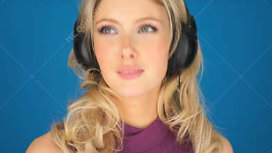 Beautiful young woman enjoying her music