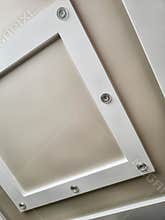 Unique ceiling design featuring recessed lighting in a modern interior space