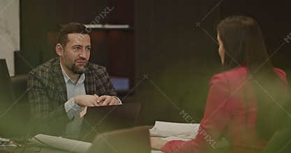 Business Professionals Negotiate and Collaborate on a Project During an Office Meeting