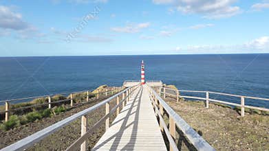 walkaway into lighthouse beacon on the Azores, panoramic view over the atlantic ocean.
