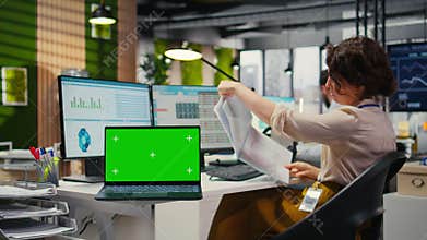 Woman business analyst reviewing forecasts with a copy space