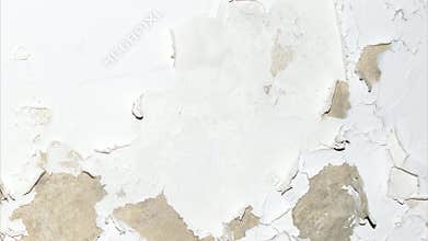 old wall with peeling white paint. background