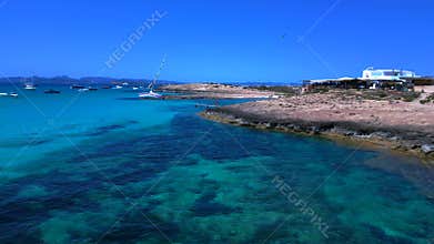 Sailboat stranded in formentera at summer. Best aerial view flight drone
