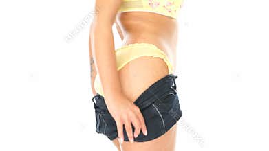 Closeup of woman's behind in yellow panties