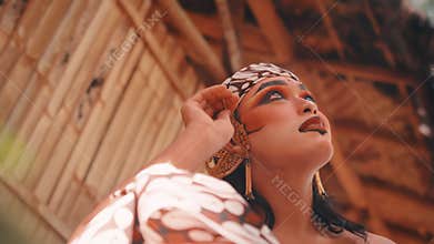 Low-Angle Shot of a Javanese Dancer Preparing for Performance