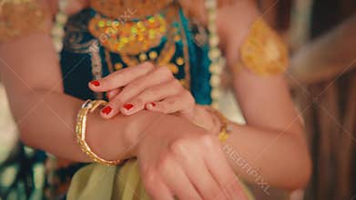 Close-up of Javanese Dancer's Hands with Red Nails
