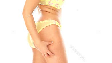 Woman measuring fat on her leg