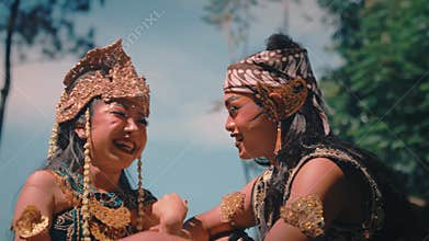 Happy Javanese Couple Laughing and Interacting in Nature