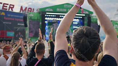 An Energetic and Lively Crowd at the Music Festivals Main Stage, Filled with Excitement
