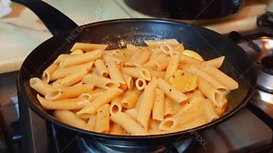 Golden Penne Pasta Thick Curry Soup With Potato Bubbling In Black Pan Hotel Kitchen