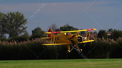 Bucker Bu 133 Jungmeister RC model in a very low altitude pass