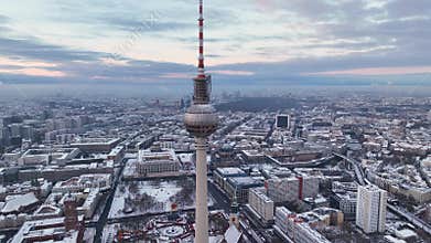 City of Berlin, Germany from above. Aerial winter cityscape view at sunrise or sunset, showing architectural landmarks