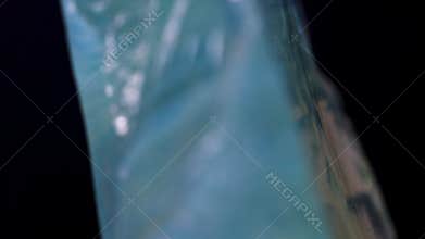 Untreated crystal fragment rotating to display irregular geometry