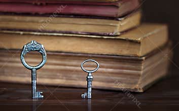 Old keys and books, escape room game background