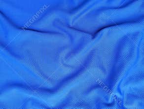 Abstrack blue silk satin texture background. Beautiful wavy soft folds on the surface of the fabric.