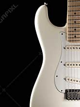 White electric guitar on black background