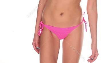 Attractive young woman in pink bikini on white