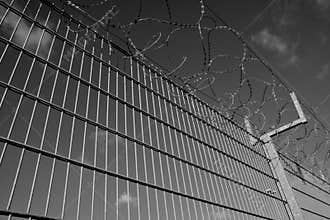 A fence with barbed wire