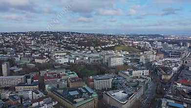 Captivating aerial view of Stuttgart showcasing the city's architecture and surrounding hills from a unique tripod