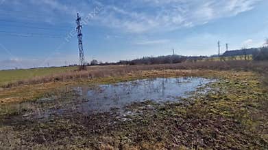 too compact and impermeable soil does not absorb water during rains and floods. a lake was created in the park in