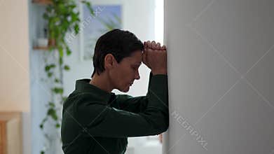 Overwhelmed mature woman with migraine rubbing forehead, struggling with exhaustion and stress