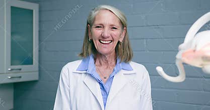 Smiling Senior Female Dentist in Modern Clinic: A Portrait of Expertise, Care, and Professionalism in Oral Healthcare
