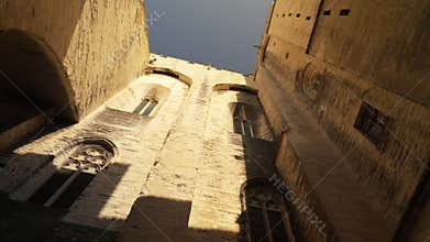 Windows in the walls of the Palais des Papes in Avignon, France