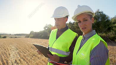 Engineers inspecting field, collaboration and expertise in action