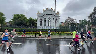 Athletes running Istanbul half marathon in historic street of Fener district