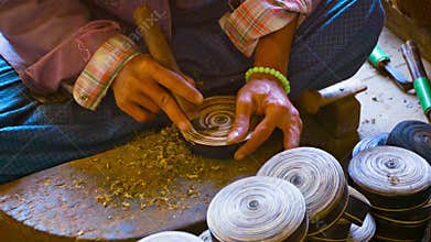 Man makes wooden utensils in the workshop. Burma