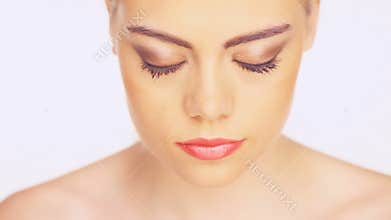 Beautiful young woman blinking