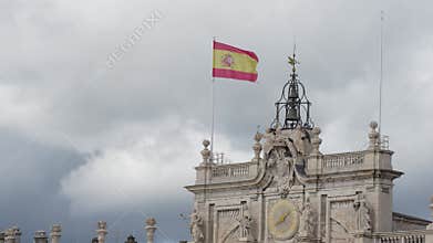 Royal Palace of Madrid under dramatic cloudy sky