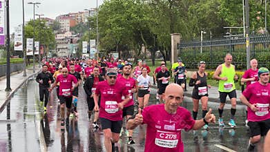 Athletes running Istanbul half marathon in historic street of Fener district