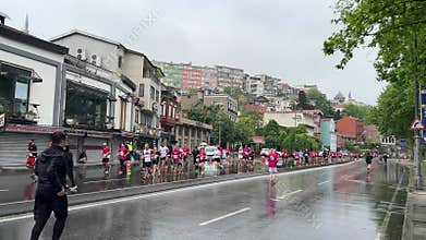 Athletes running Istanbul half marathon in historic street of Fener district